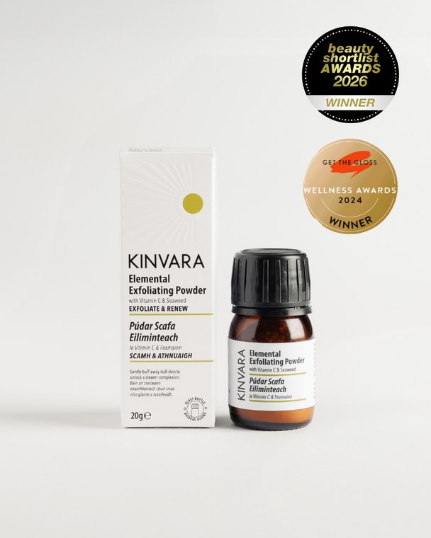 Elemental Exfoliating Powder in a small amber jar beside its carton, with award badges